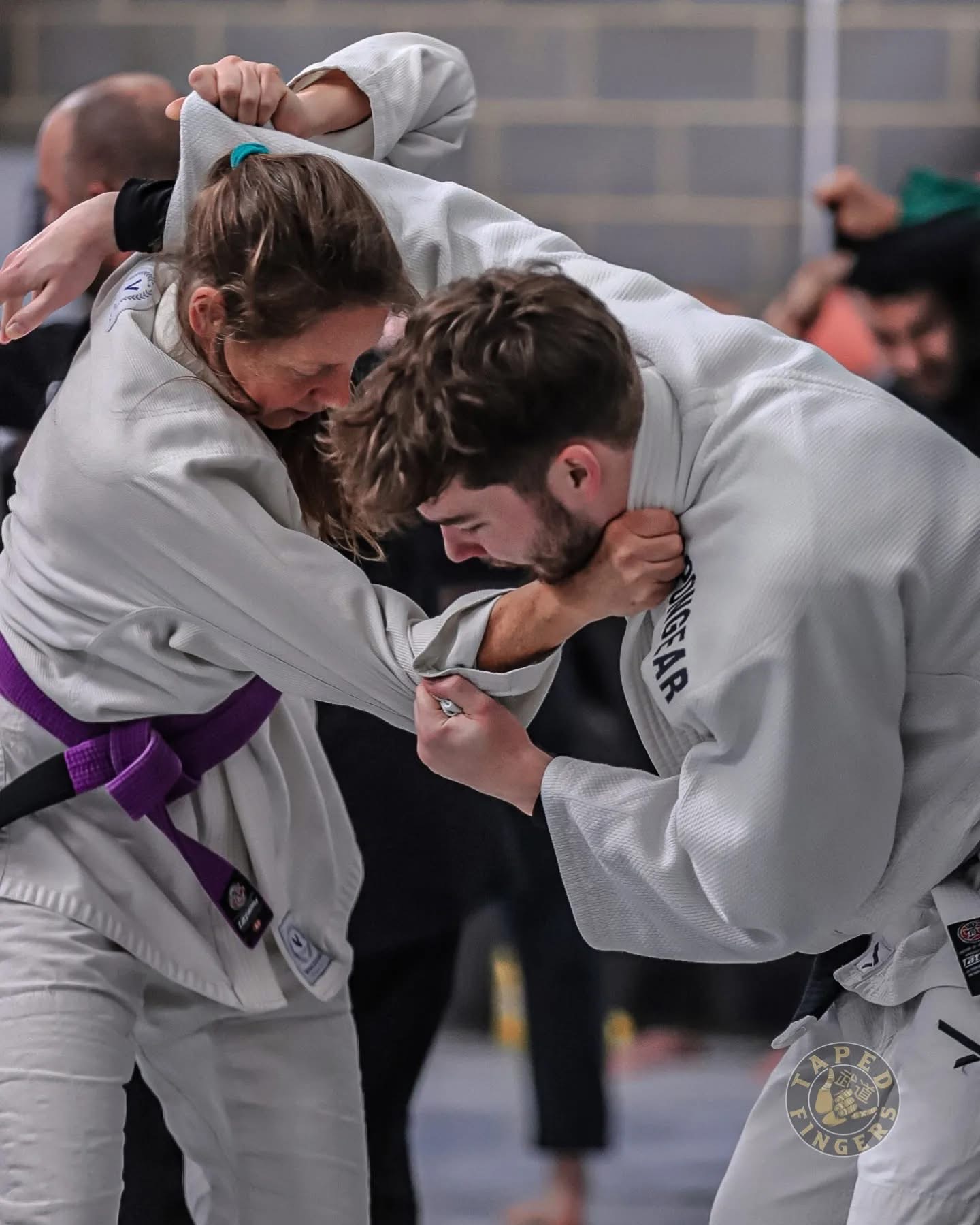 Two training partners practising Gi Jiu-Jitsu